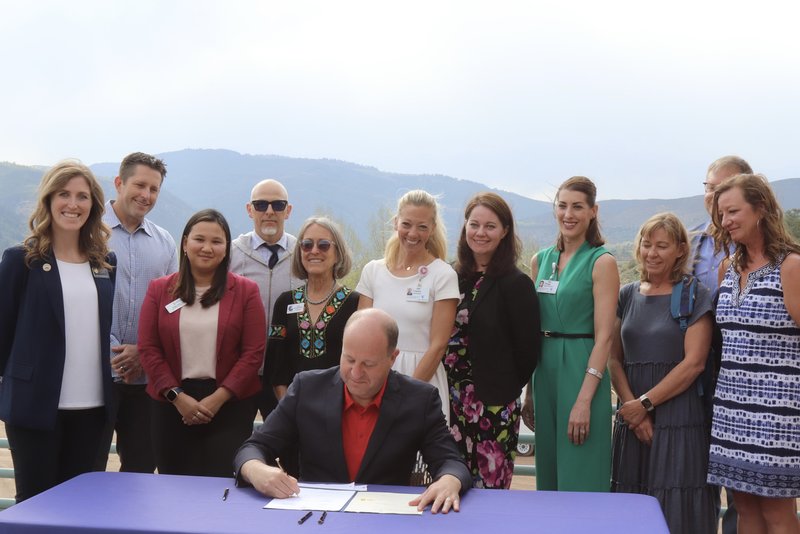 Jared Polis stops in Edwards, EagleVail to sign bills addressing housing and behavioral health